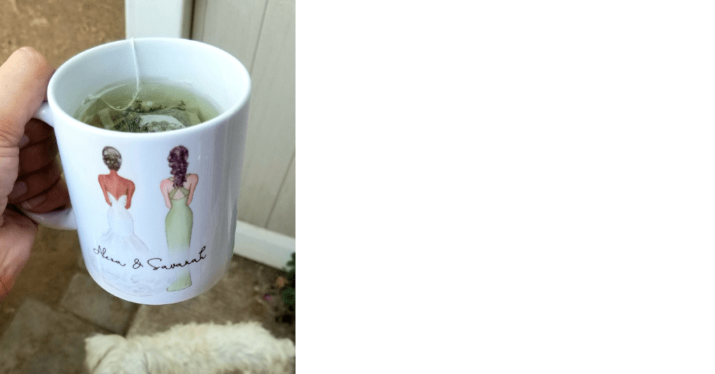 green tea in a mug with painted images of two women from the back