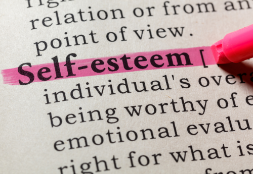 Definition of "self-esteem" highlighted in pink in a dictionary