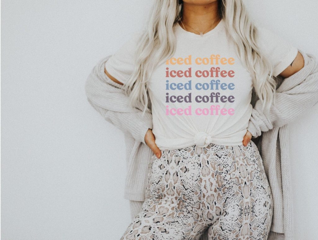 Woman in a T-Shirt that reads "Iced coffee" repeatedly, in different colors