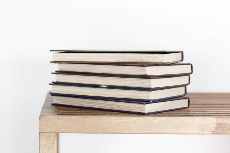 Stack of books on a wooden table